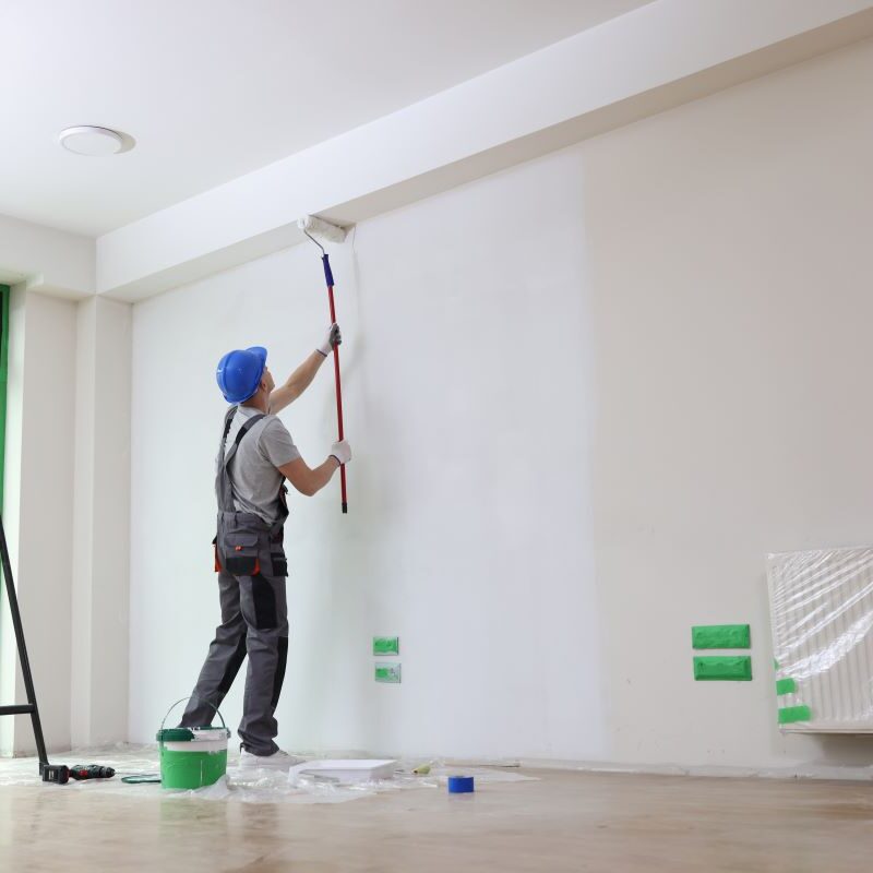 Painter painting interior walls with a roller in Reno, Nevada