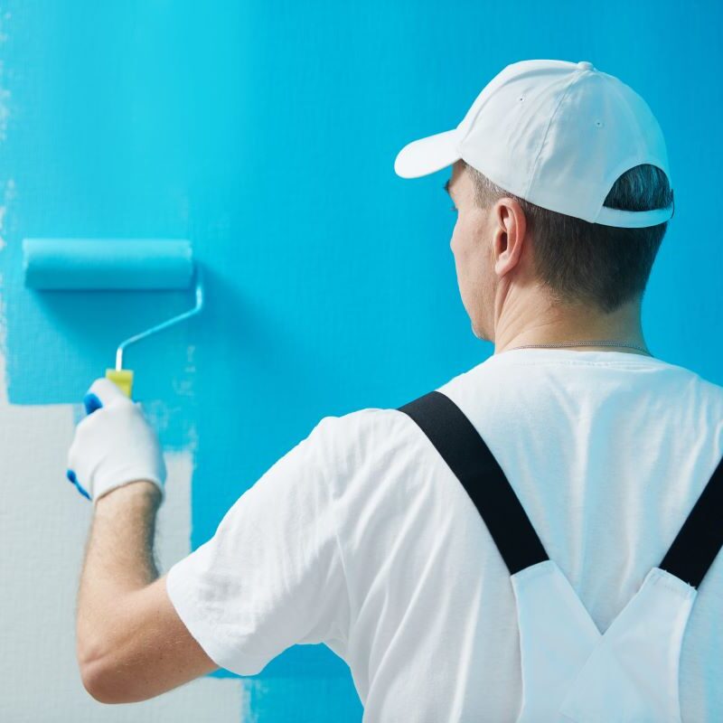 Professional painter applying fresh paint on a wall in Reno, NV.